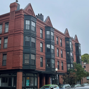 Older 4-story brick mixed-use building 