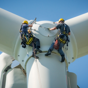 Need for Speed blog hero Two men, suspended from top of wind turbine performance maintenance.