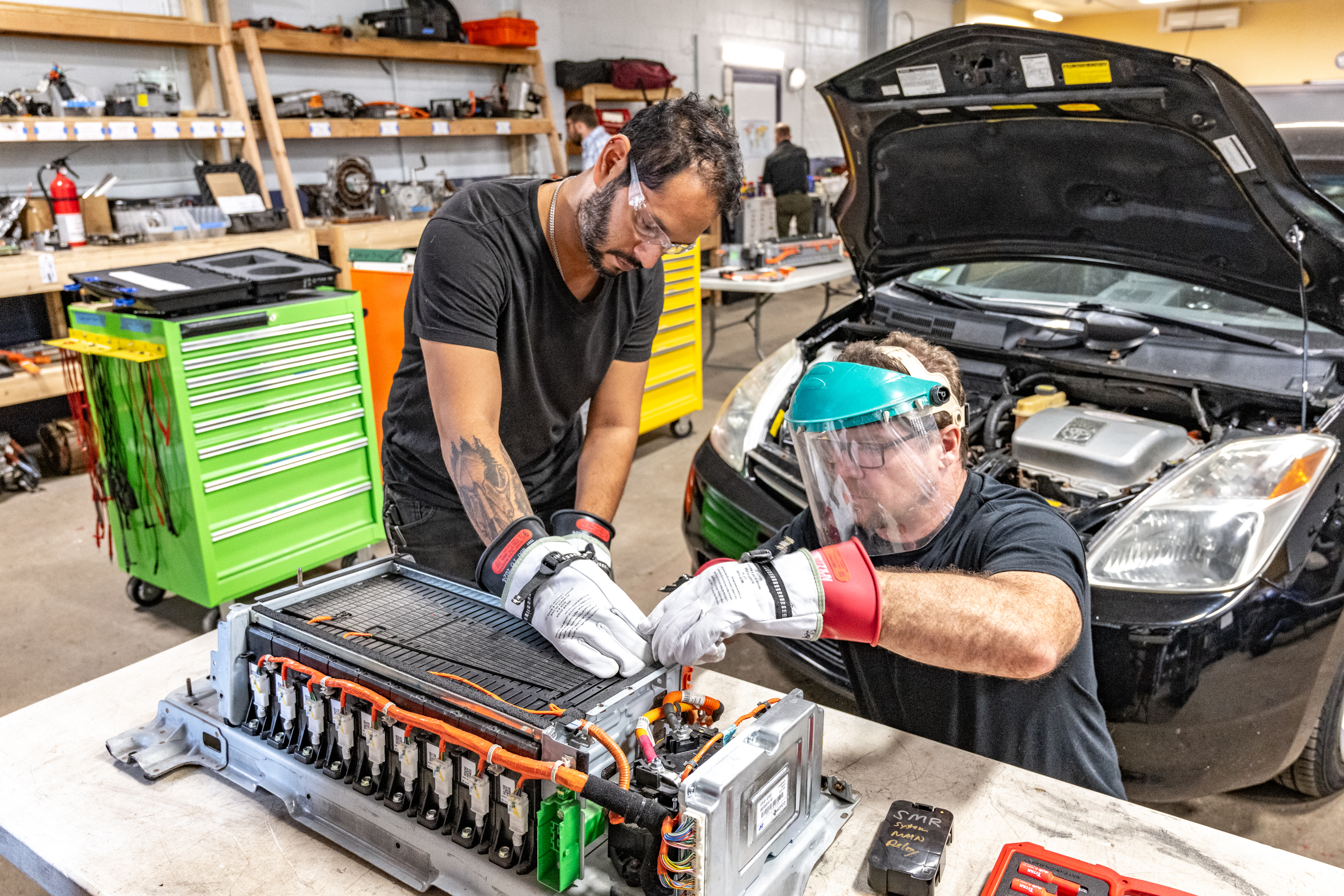 Mechanics work on Toyota Prius Mechanics work on Toyota Prius