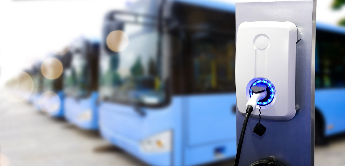 Row of buses and an EV charging station