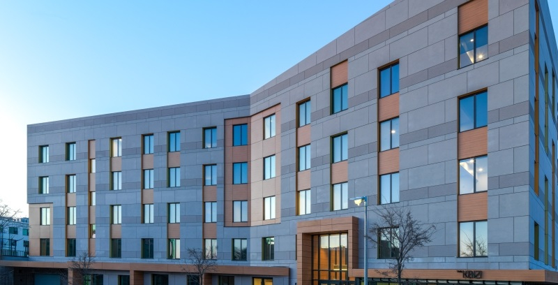 Exterior view of new 4-story multifamily apartment building